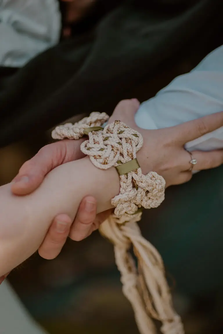 Close-up of holding hands during vows Close-up of a couple holding hands during their personalised wedding ceremony in Ireland
